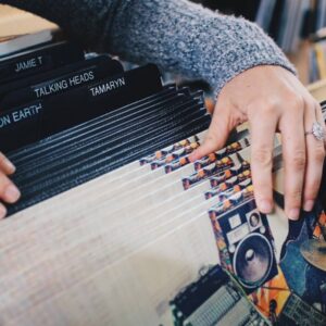 A person playing an accordion on top of a table.