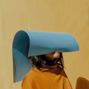 A person with a paper hat on their head